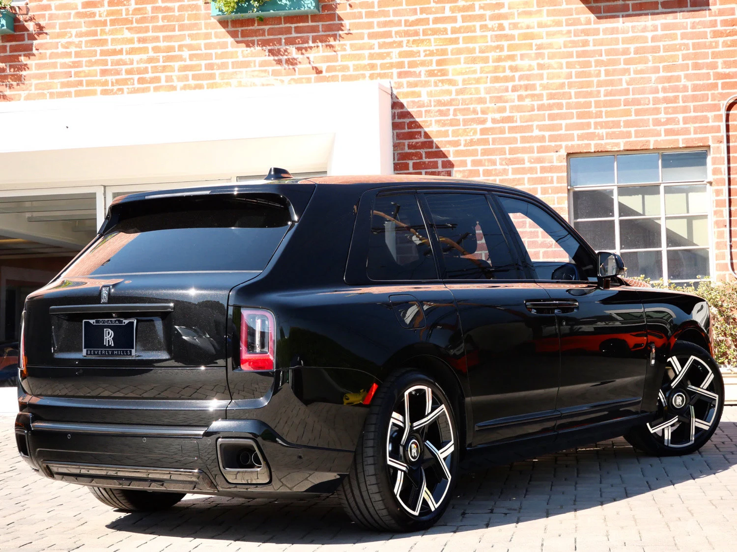 2027 Rolls-Royce Black Badge Cullinan, rear three-quarter view, Black