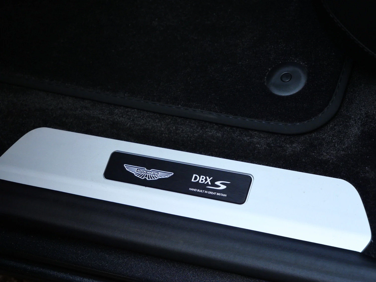2026 Aston Martin DBX S interior, door sill, Onyx Black - Semi Aniline