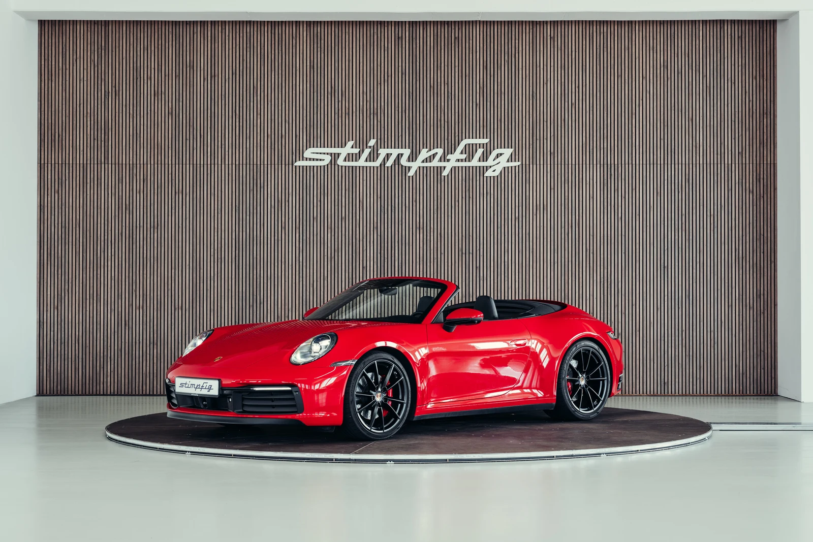 Porsche 911 (992.1) Carrera 4S Cabriolet, full-car front three-quarter view.