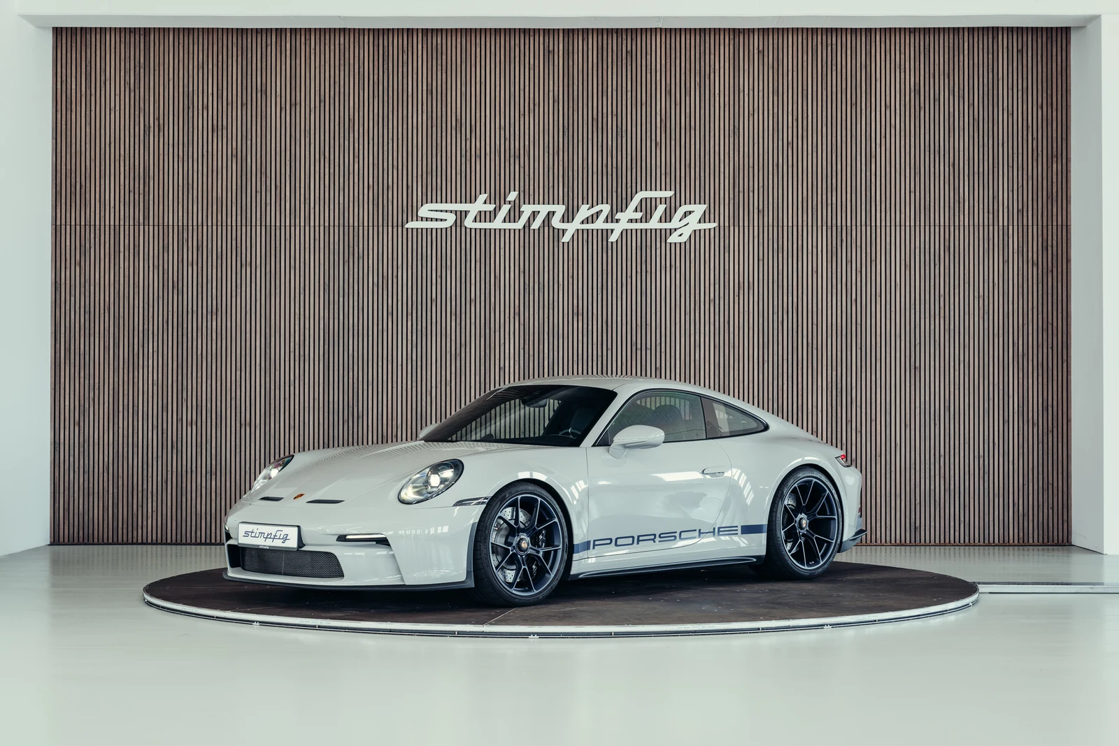 Porsche 911 (992.1) GT3 Touring, full-car front three-quarter view.