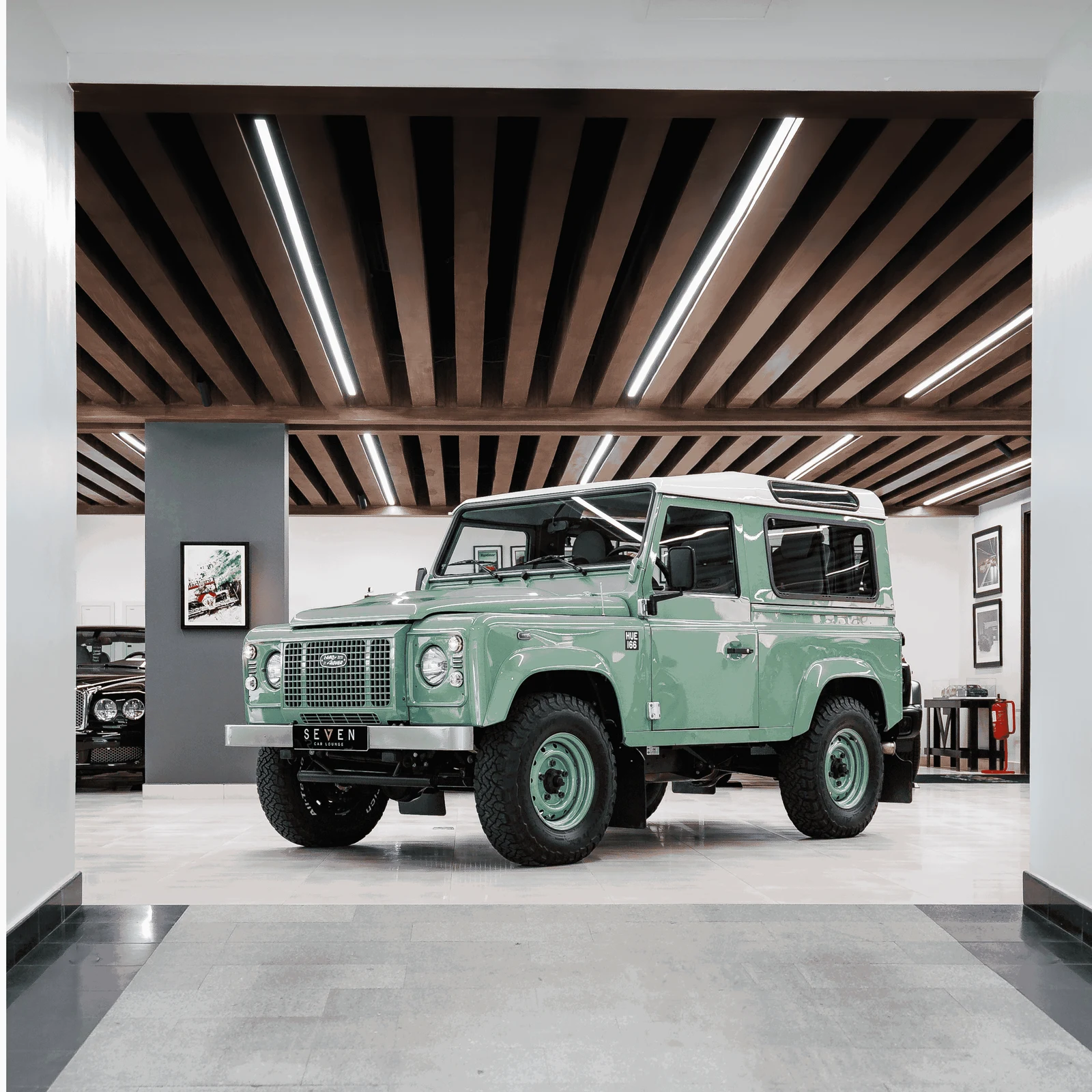 Land Rover Defender Heritage · Green and Alaska White. · Seven Car Lounge