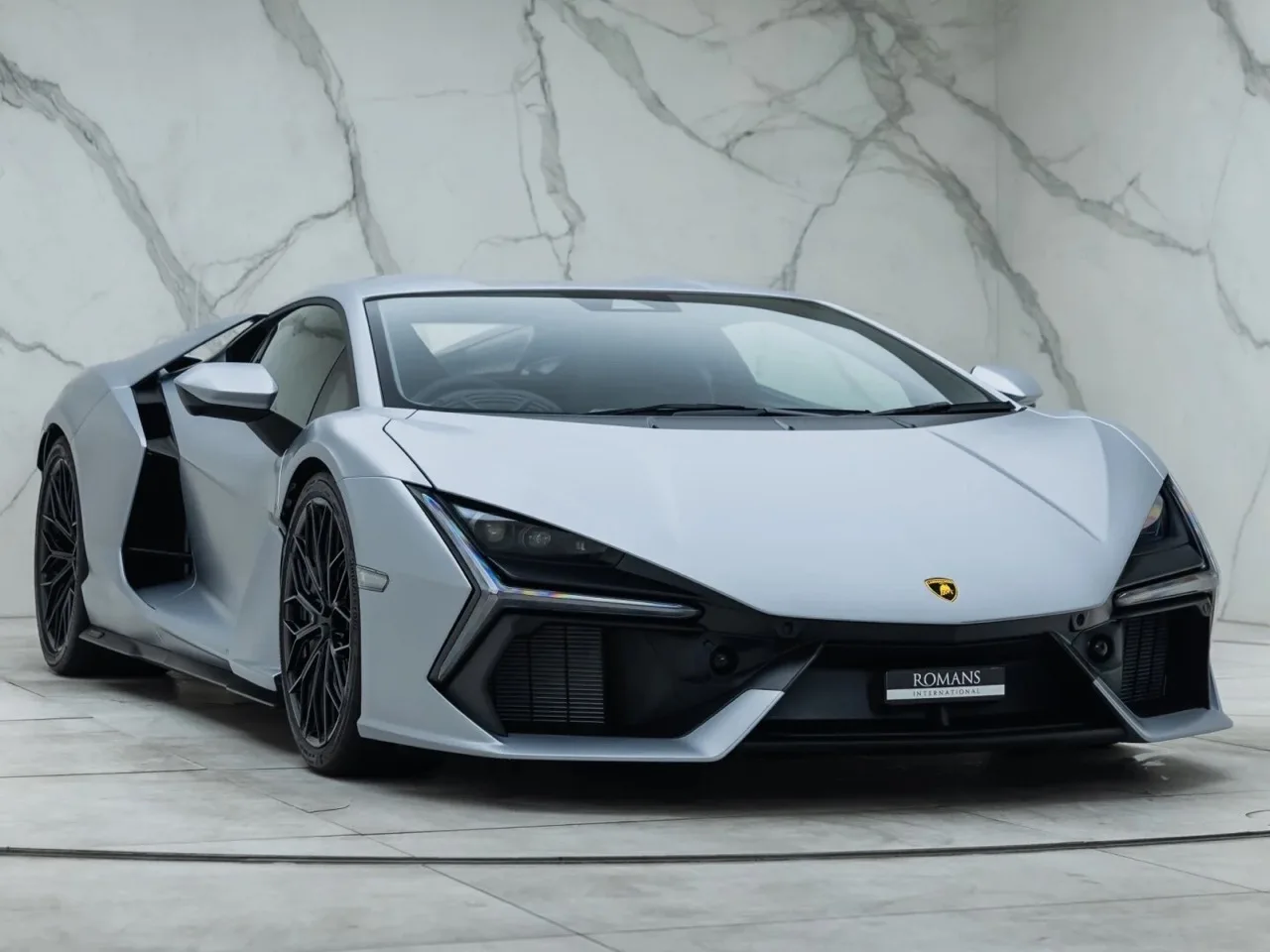 2024 Lamborghini Revuelto for sale, front three-quarter view, Grigio Nimbus Metallic