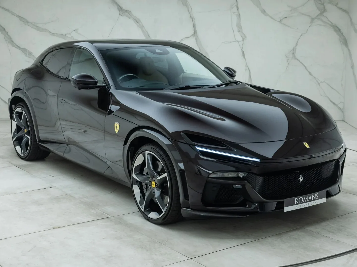 2024 Ferrari Purosangue for sale, front three-quarter view, Nero Purosangue