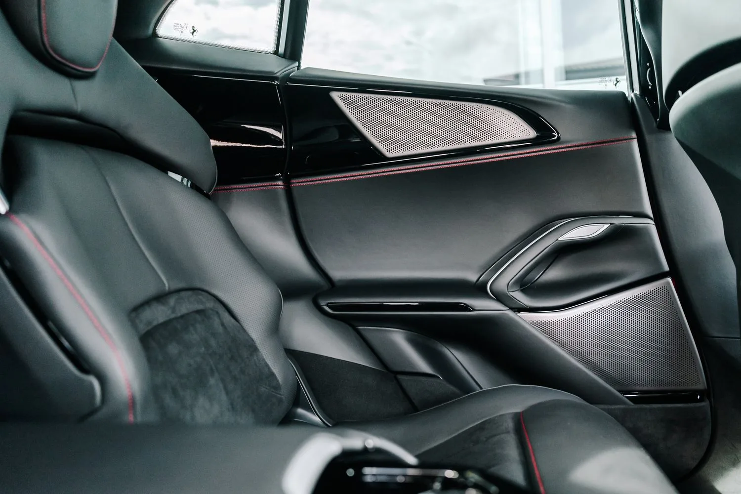 2024 Ferrari Purosangue interior, door panel, Nero Hide and Alcantara