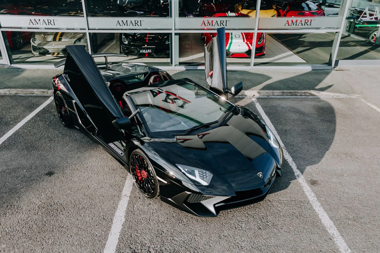 2016 Lamborghini Aventador SV Roadster for sale, exterior, Nero Cosmus w/ Rosso Alala