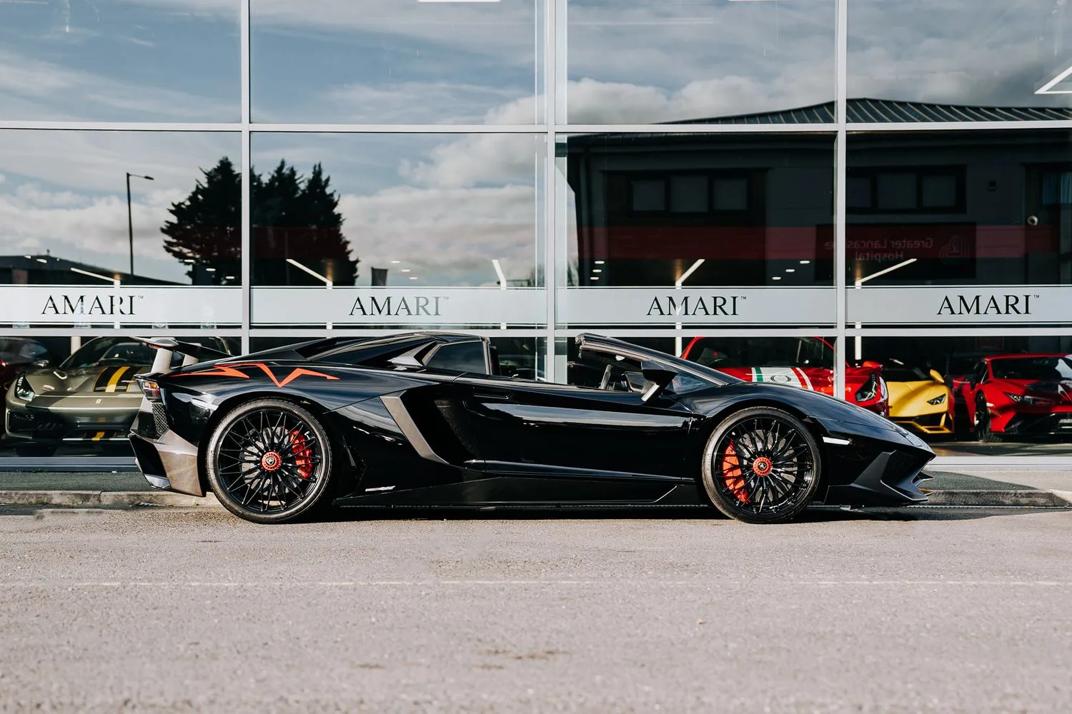 2016 Lamborghini Aventador SV Roadster for sale, exterior, Nero Cosmus w/ Rosso Alala