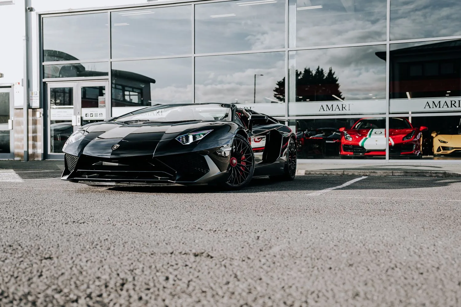2016 Lamborghini Aventador SV Roadster for sale, exterior, Nero Cosmus w/ Rosso Alala