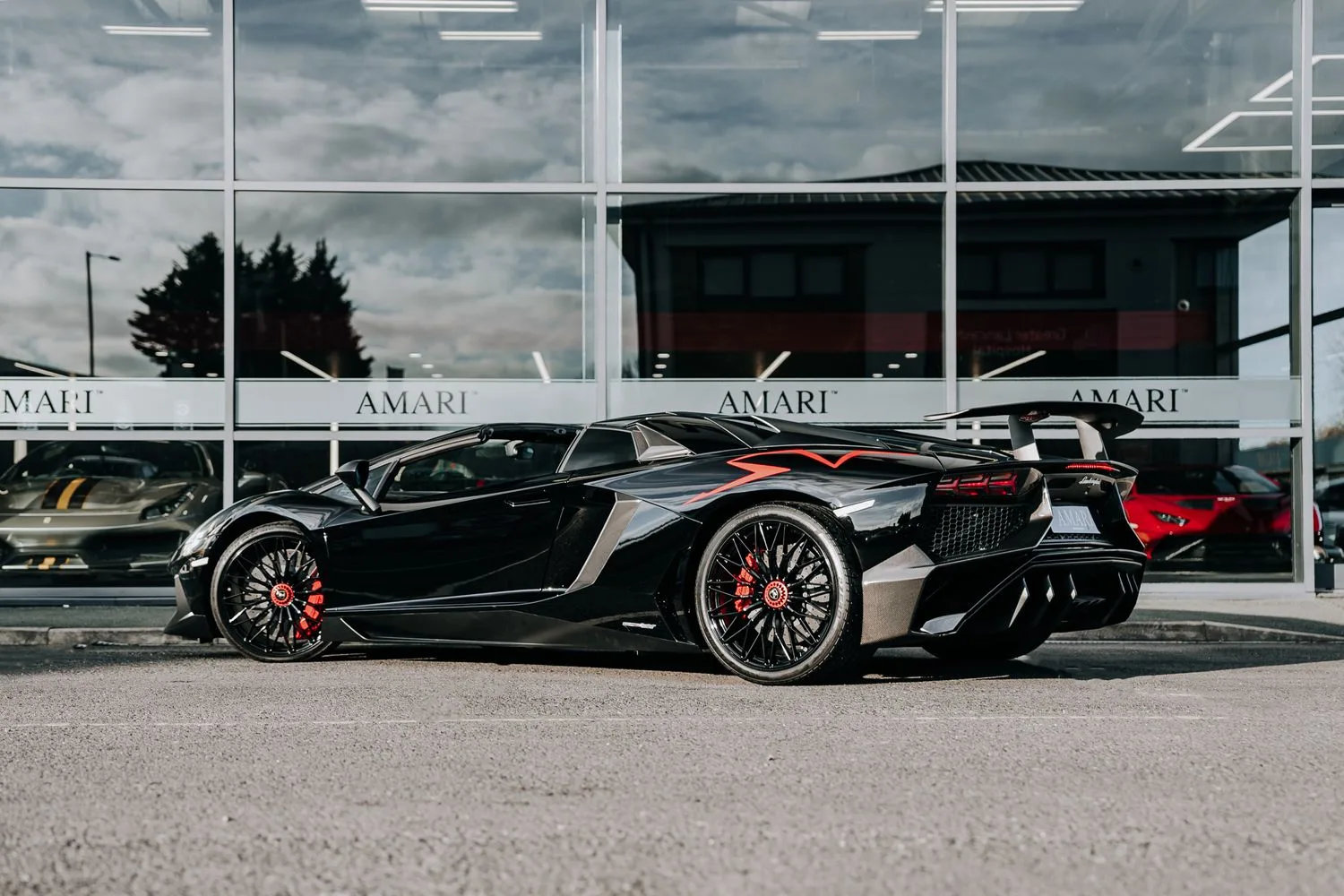 2016 Lamborghini Aventador SV Roadster for sale, exterior, Nero Cosmus w/ Rosso Alala