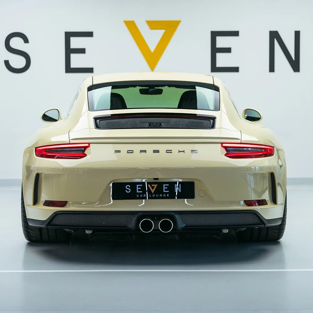 2024 Porsche 911 GT3 Touring, rear three-quarter view, Creamy White