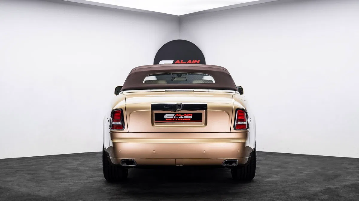 2016 Rolls-Royce Phantom Drophead, rear three-quarter view, Gold Brown