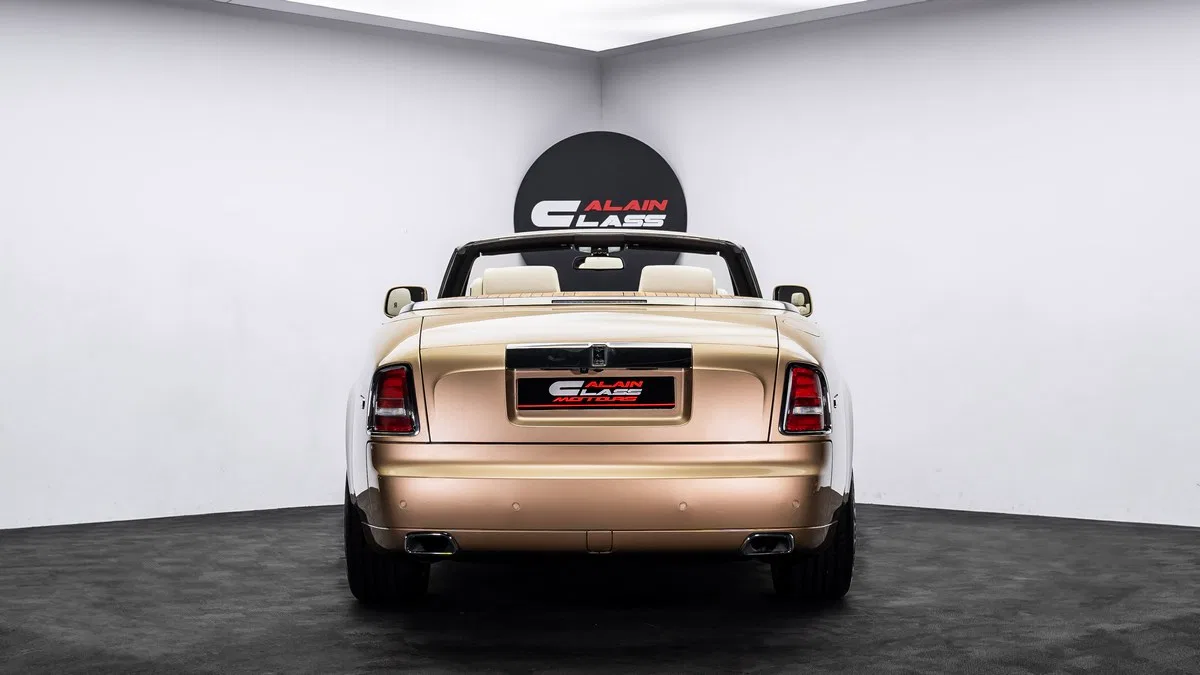 2016 Rolls-Royce Phantom Drophead, rear three-quarter view, Gold Brown