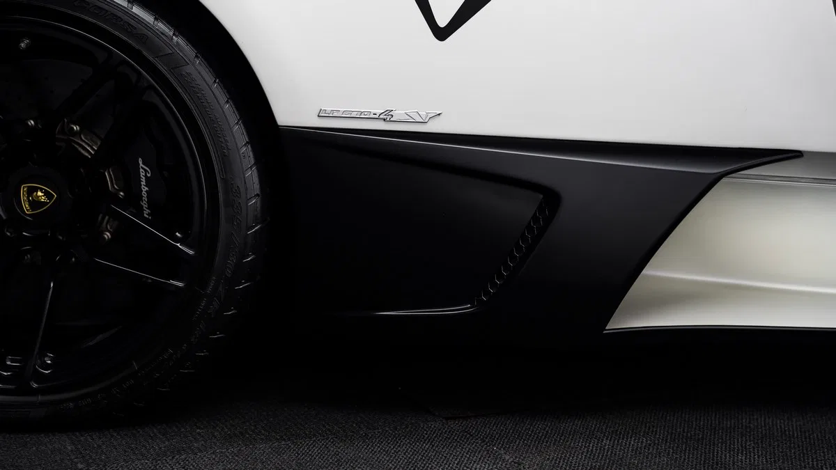 2010 Lamborghini Murciélago SV LP670-4, side profile, Bianco Canopus