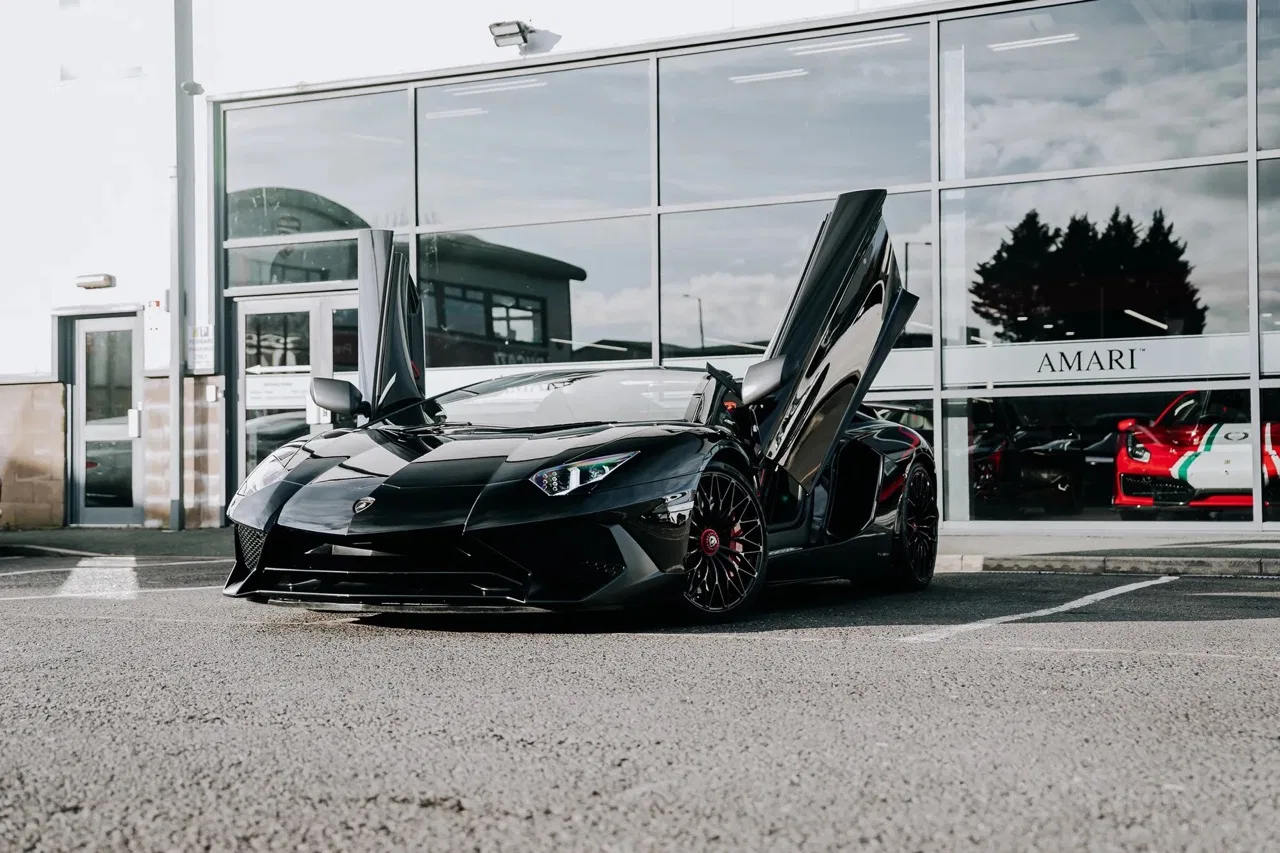 2016 Lamborghini Aventador SV Roadster for sale, exterior, Nero Cosmus w/ Rosso Alala