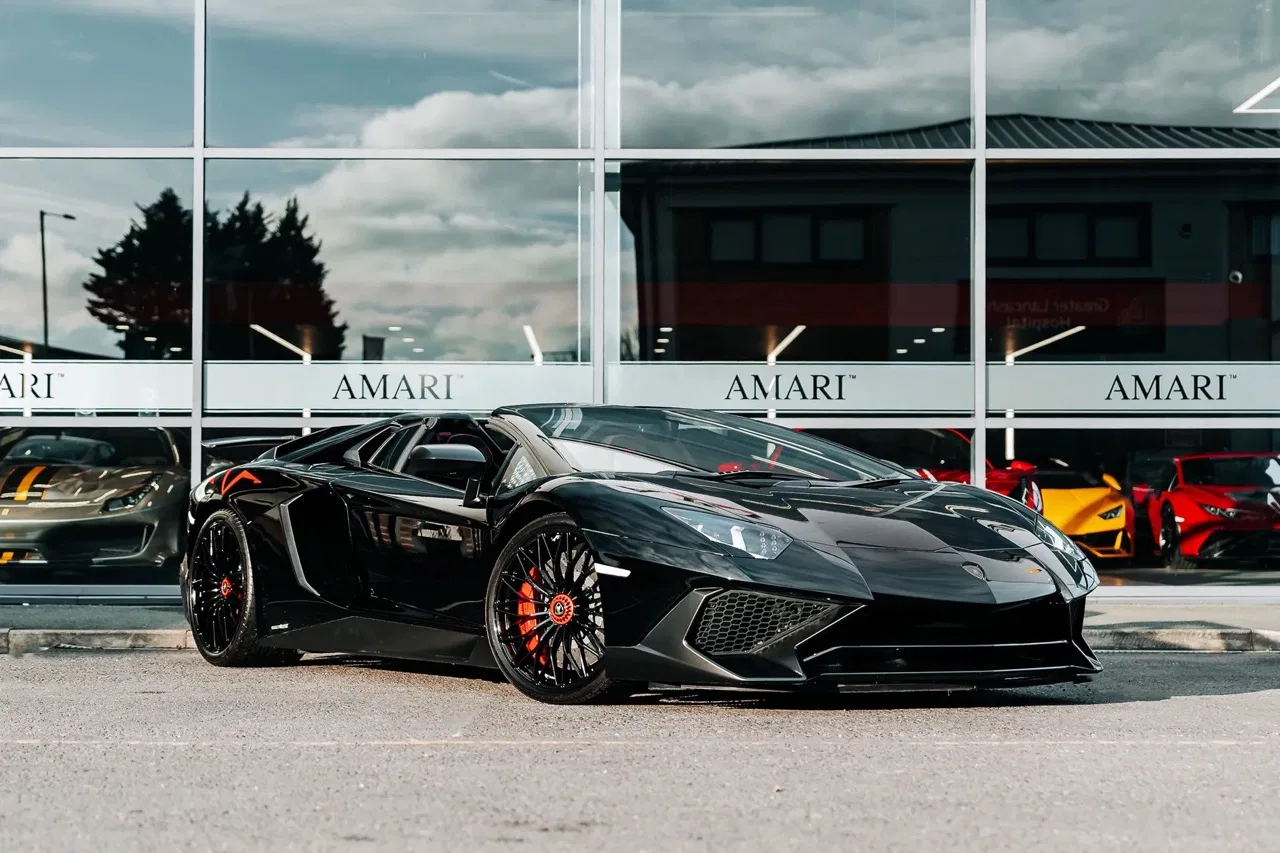2016 Lamborghini Aventador SV Roadster for sale, exterior, Nero Cosmus w/ Rosso Alala