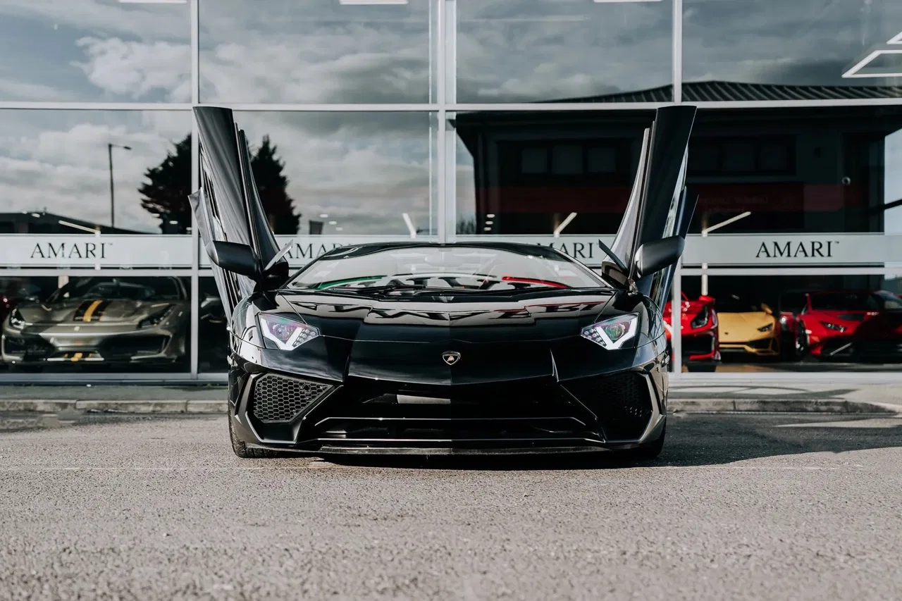 2016 Lamborghini Aventador SV Roadster for sale, exterior, Nero Cosmus w/ Rosso Alala