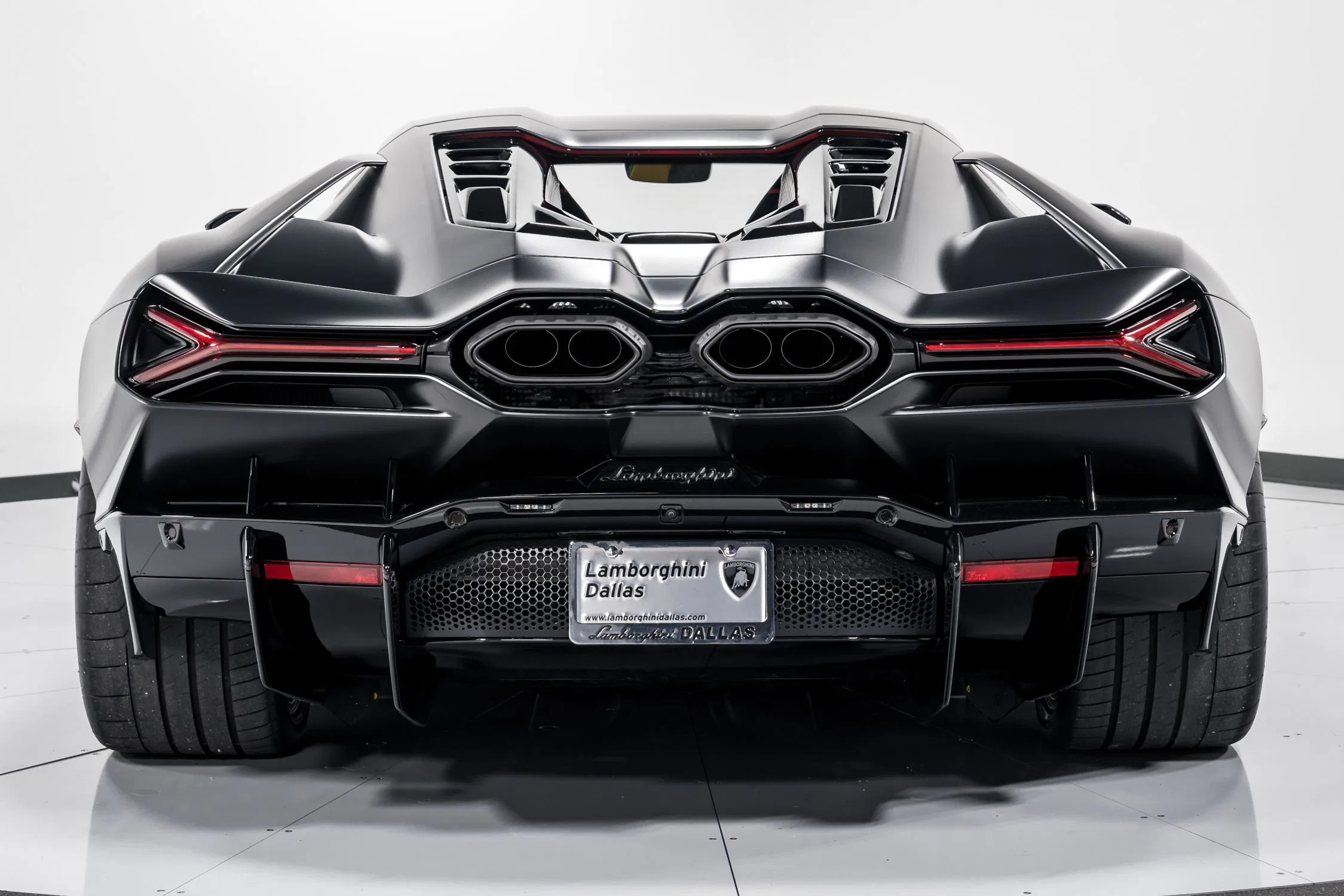 2024 Lamborghini Revuelto, rear three-quarter view, Nero Nemesis