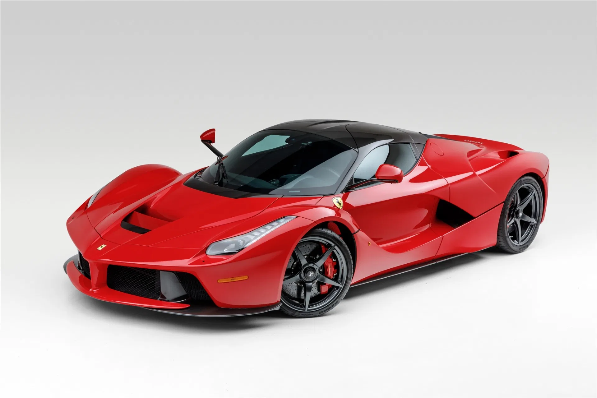 2015 Ferrari LaFerrari for sale, front three-quarter view, Rosso Corsa