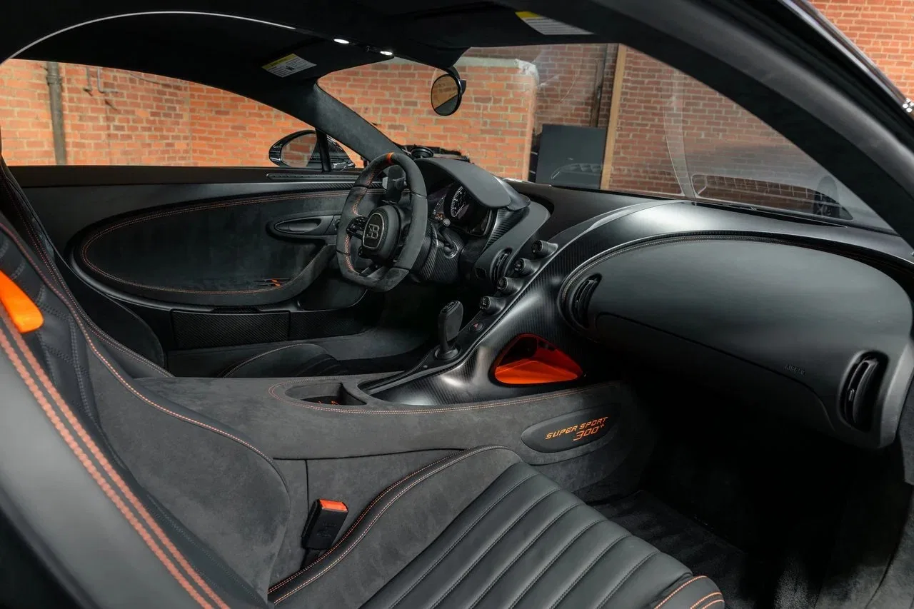 2022 Bugatti Chiron Super Sport 300+ interior, Beluga Black with Jet Orange accents