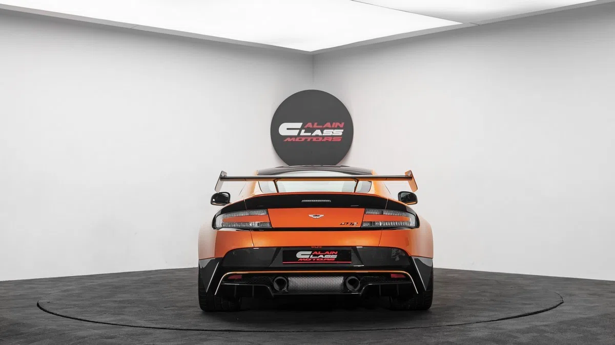 2016 Aston Martin Vantage GT12, rear three-quarter view, Orange