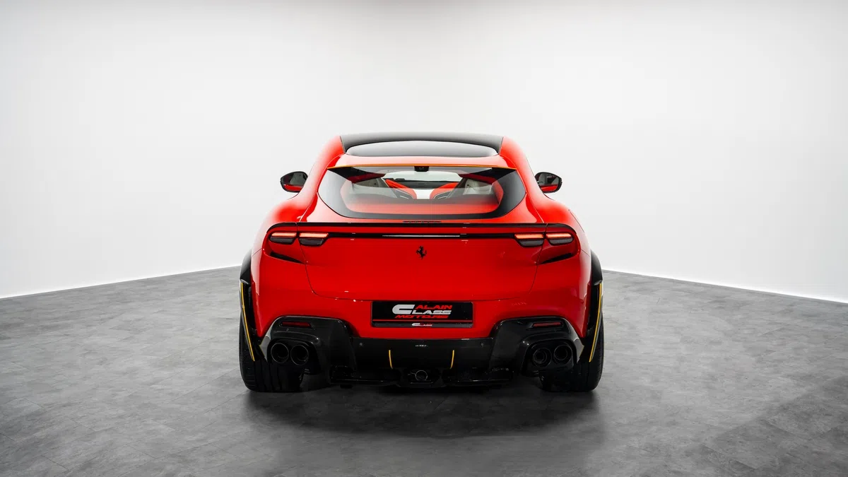 2025 Purosangue ESTESO, rear three-quarter view, Rosso Scuderia