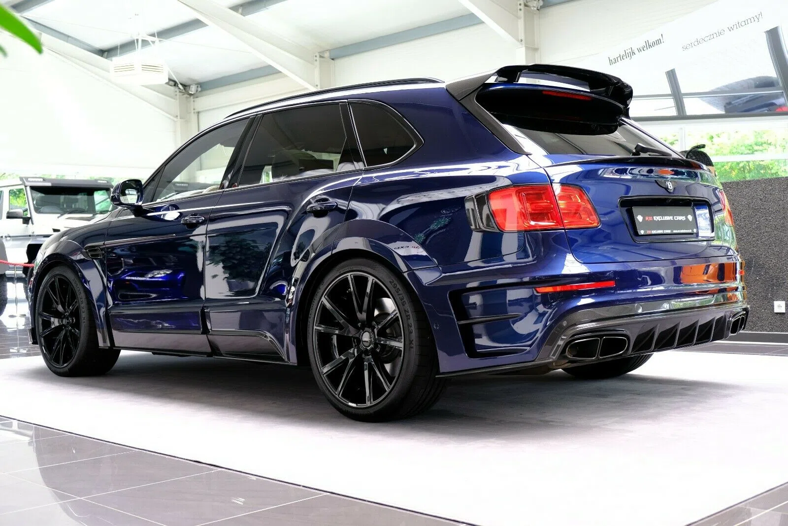 2017 Mansory Bentayga, rear three-quarter view, Blue
