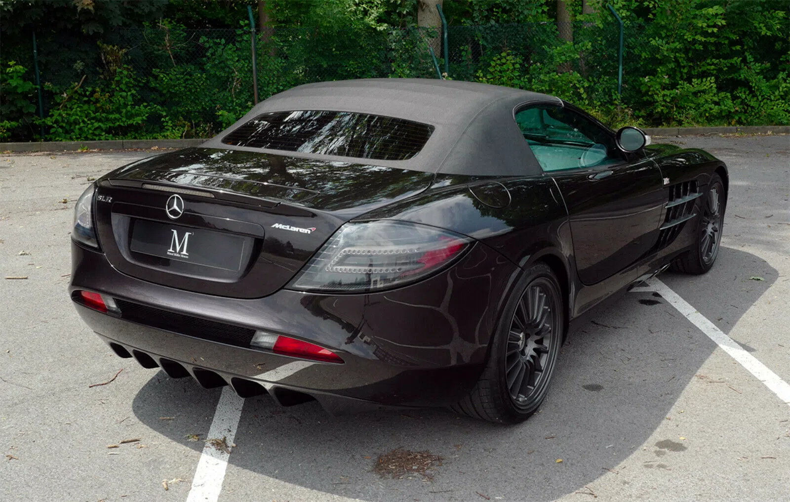 2009 Mercedes-Benz SLR McLaren 722 S Roadster, rear three-quarter view, Black