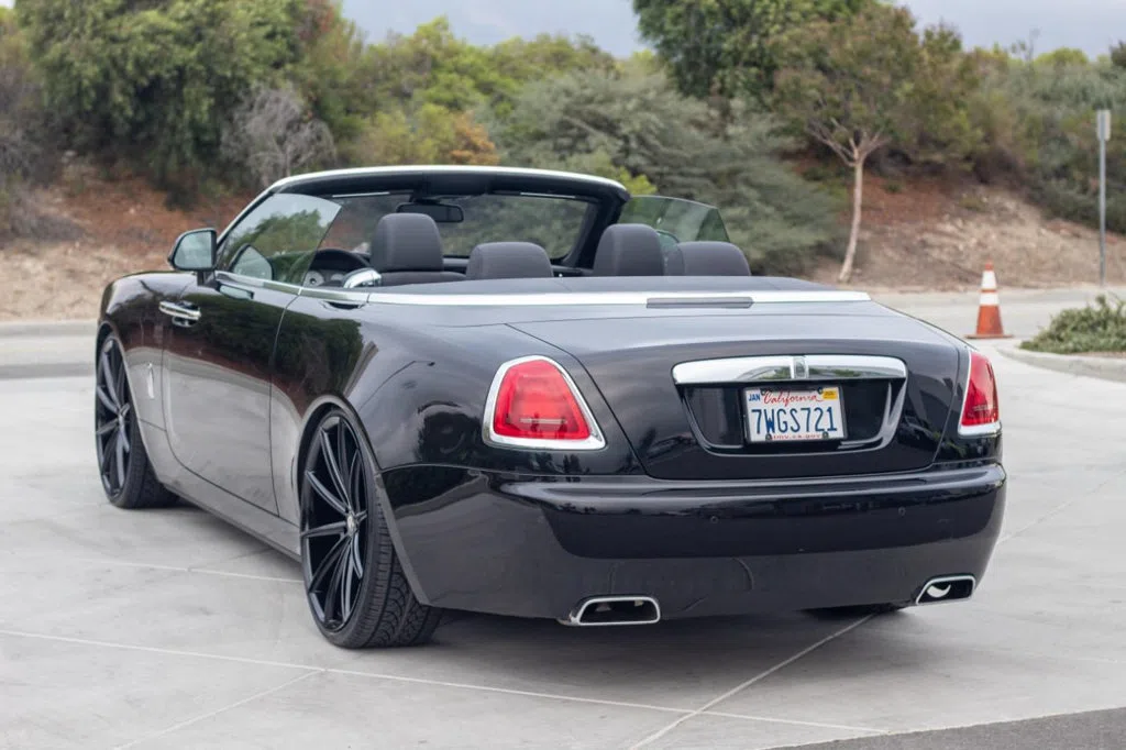 2016 Rolls-Royce Dawn, rear three-quarter view, Black