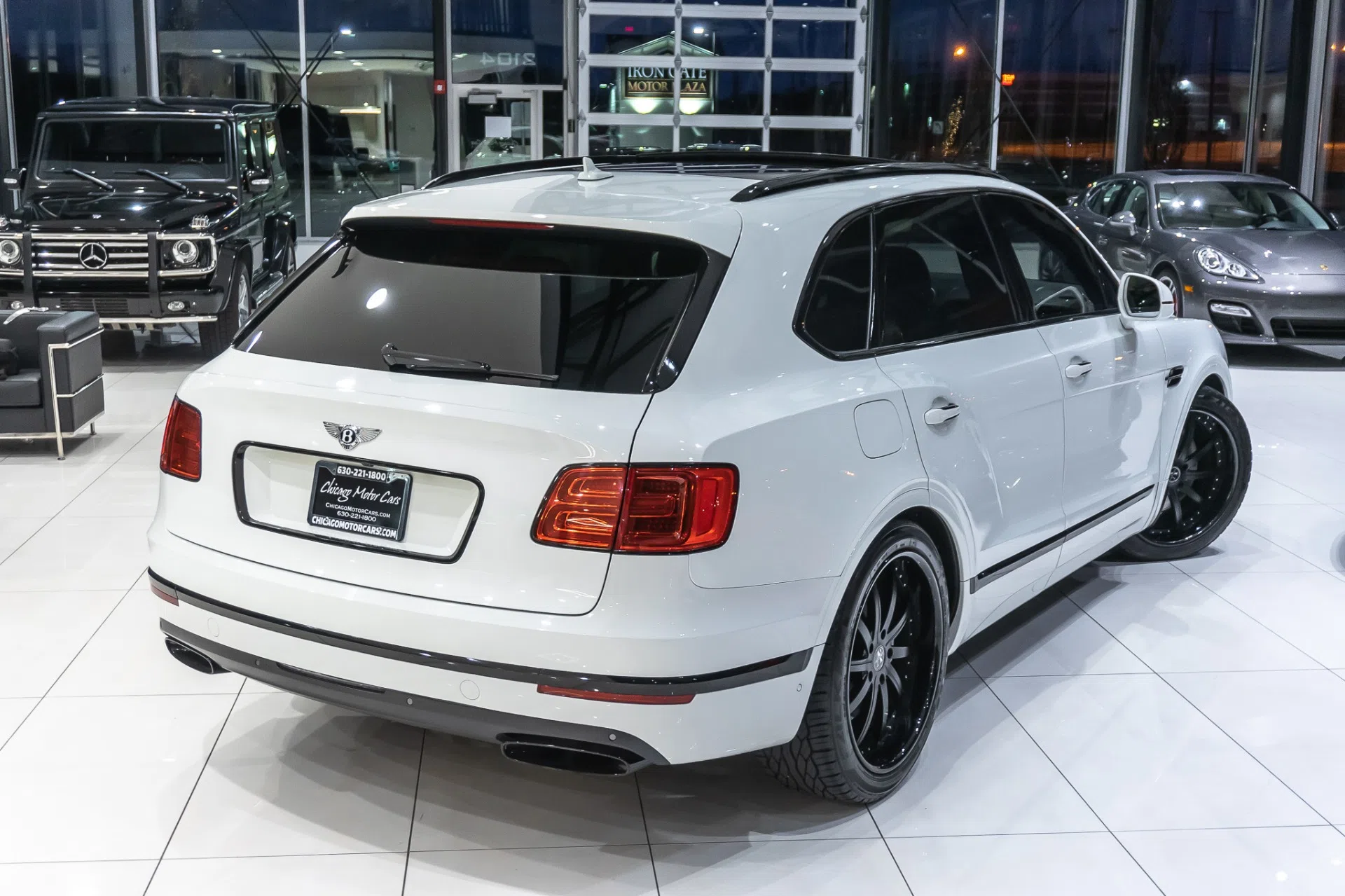 2017 Bentley Bentayga W12, rear three-quarter view, Glacier White Solid