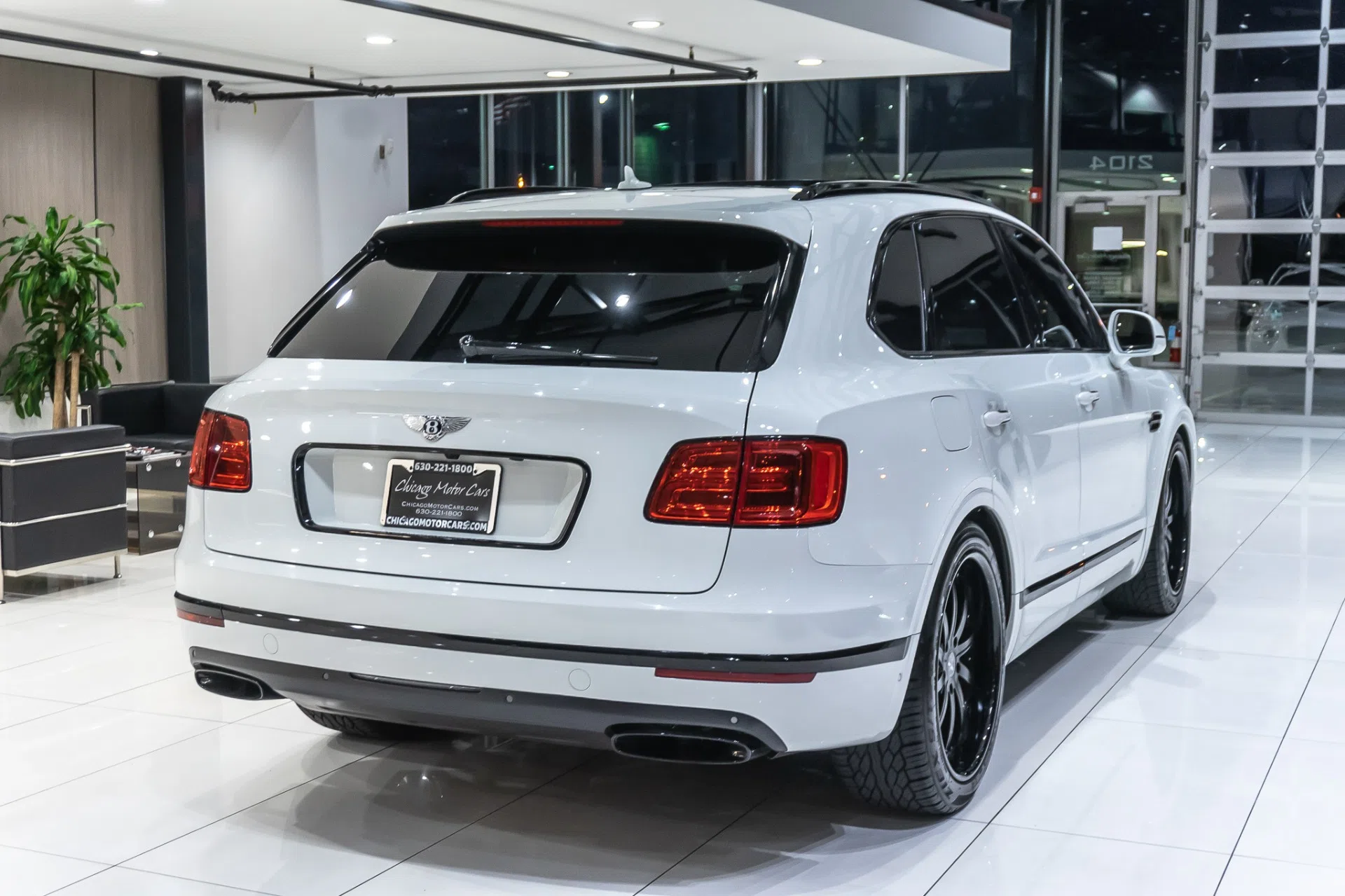2017 Bentley Bentayga W12, rear three-quarter view, Glacier White Solid