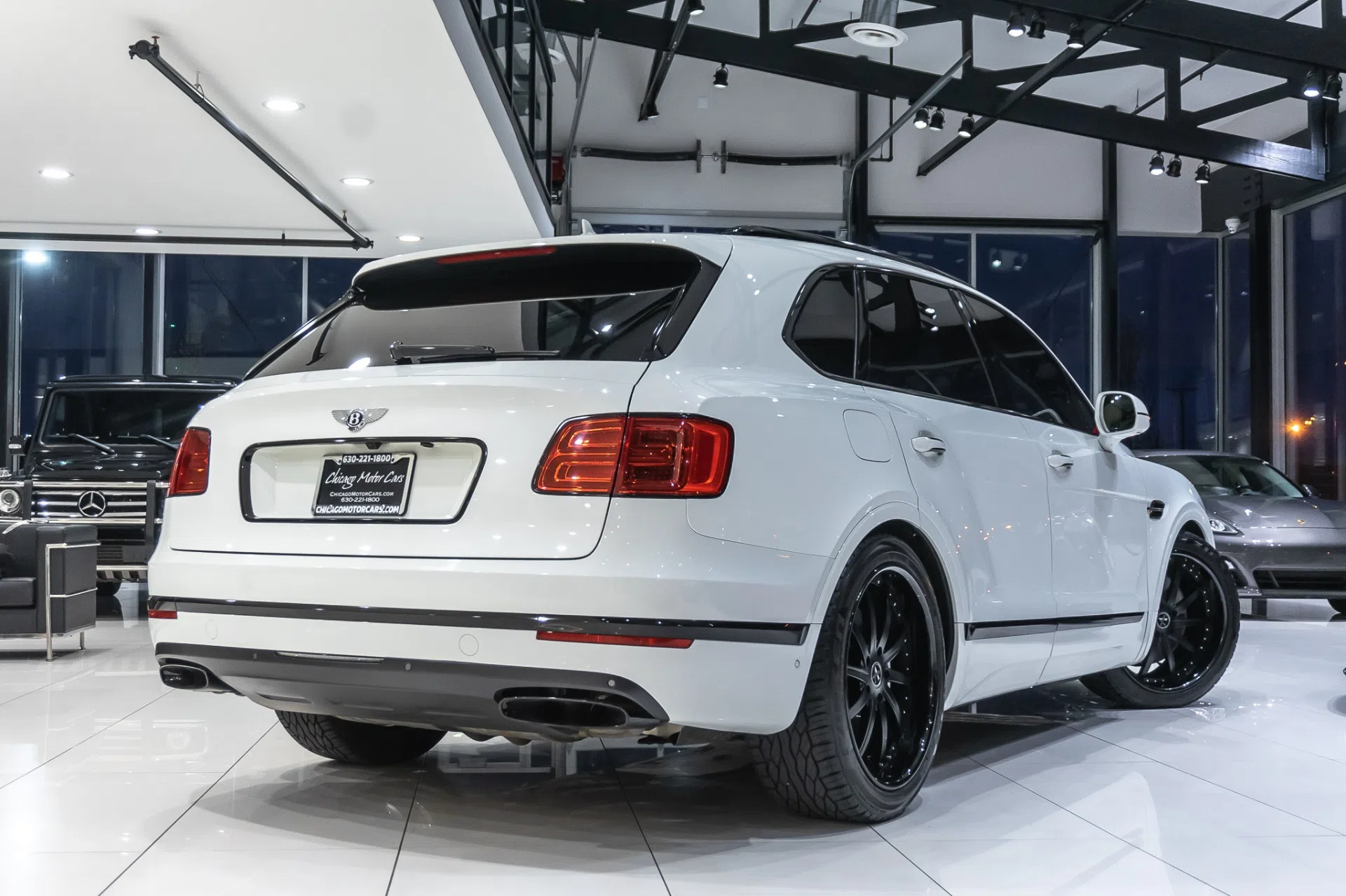 2017 Bentley Bentayga W12, rear three-quarter view, Glacier White Solid
