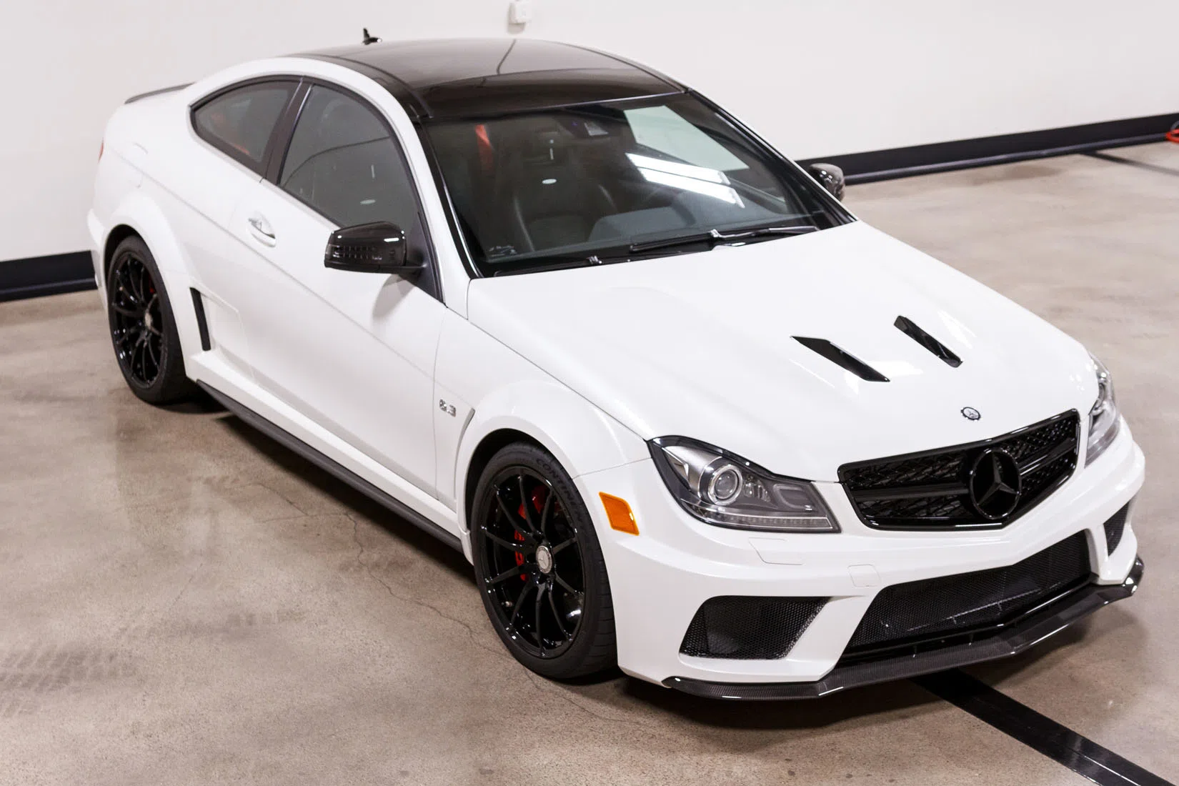 2013 Mercedes-Benz C63 AMG Black Series for sale, front three-quarter view, Diamond White