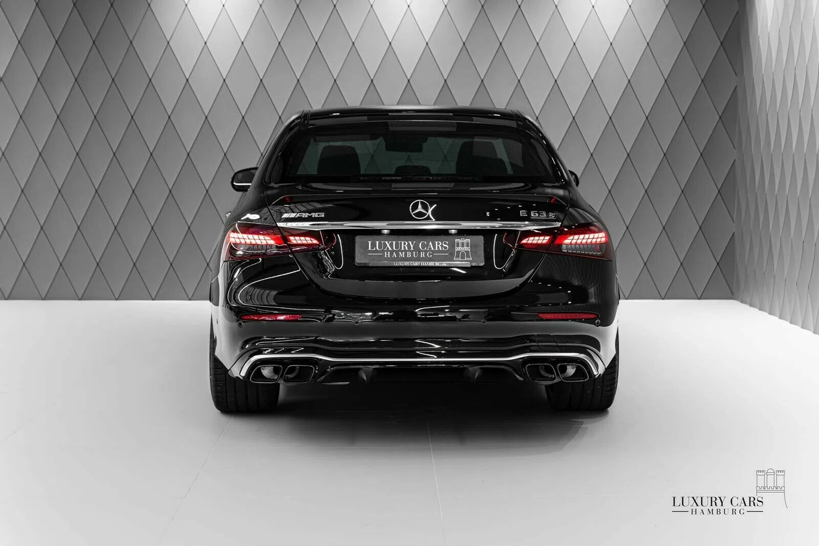 2020 Mercedes-Benz E 63 AMG S+, rear three-quarter view, Black
