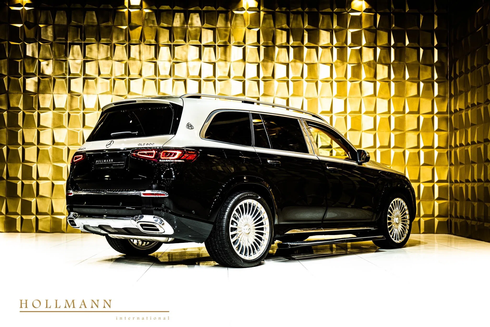 2021 Mercedes-Maybach GLS 600, rear three-quarter view, Obsidian Black + Kalahari Gold