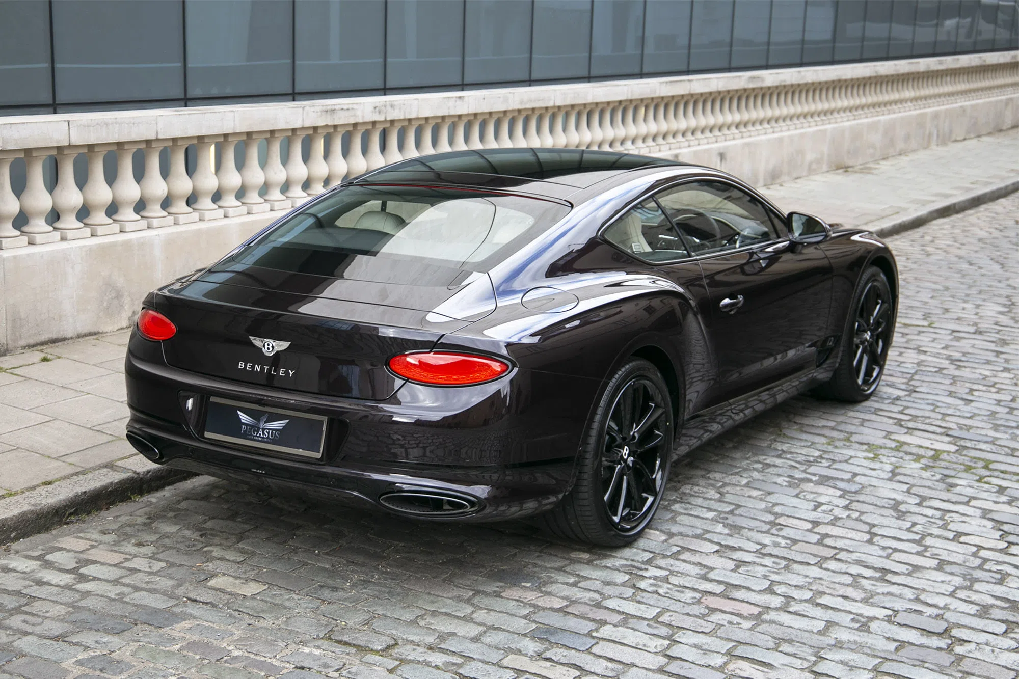 2021 Bentley Continental GT, rear three-quarter view, Black Velvet
