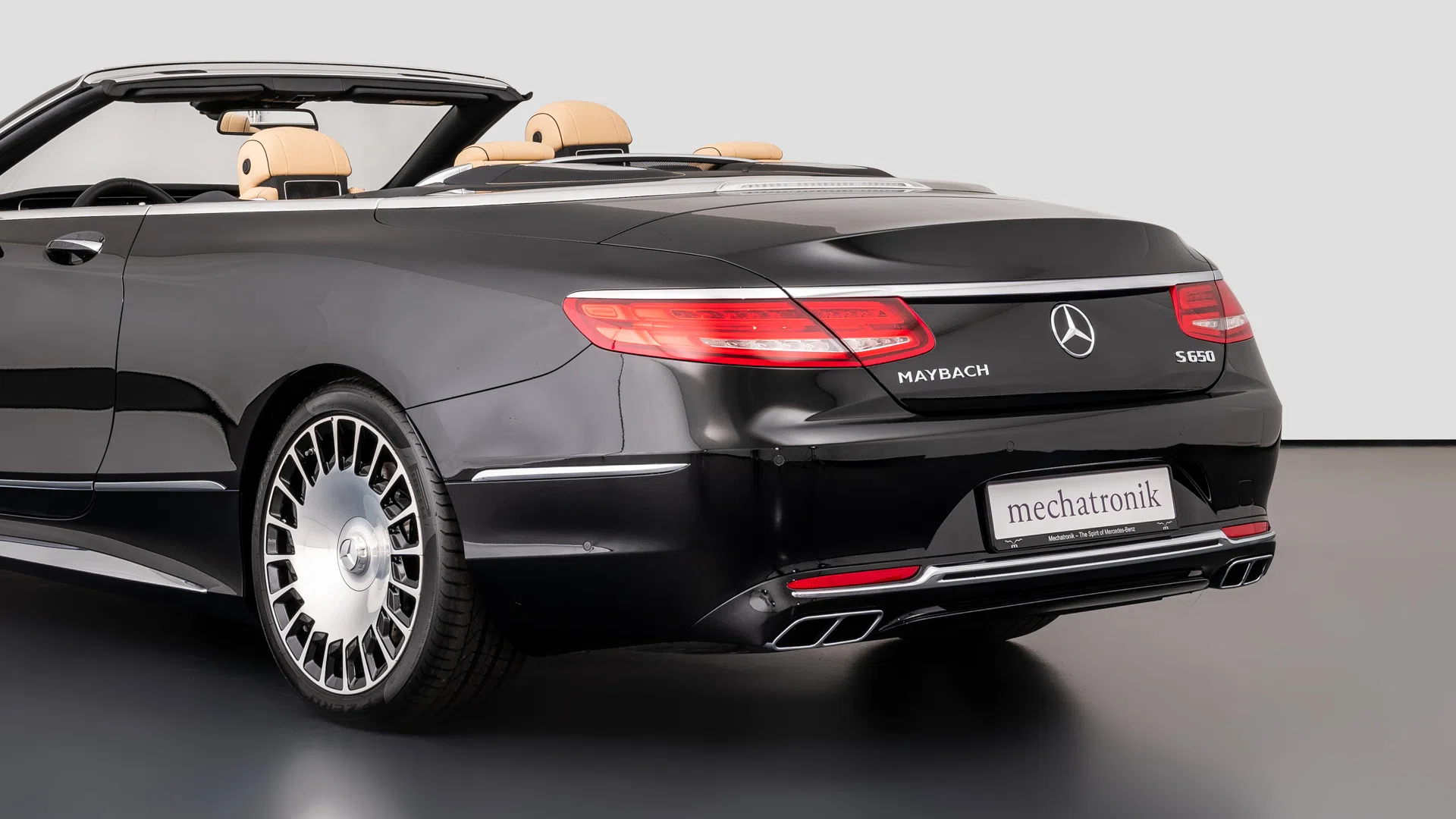 2017 Mercedes-Maybach S650 Cabriolet, rear three-quarter view, Black