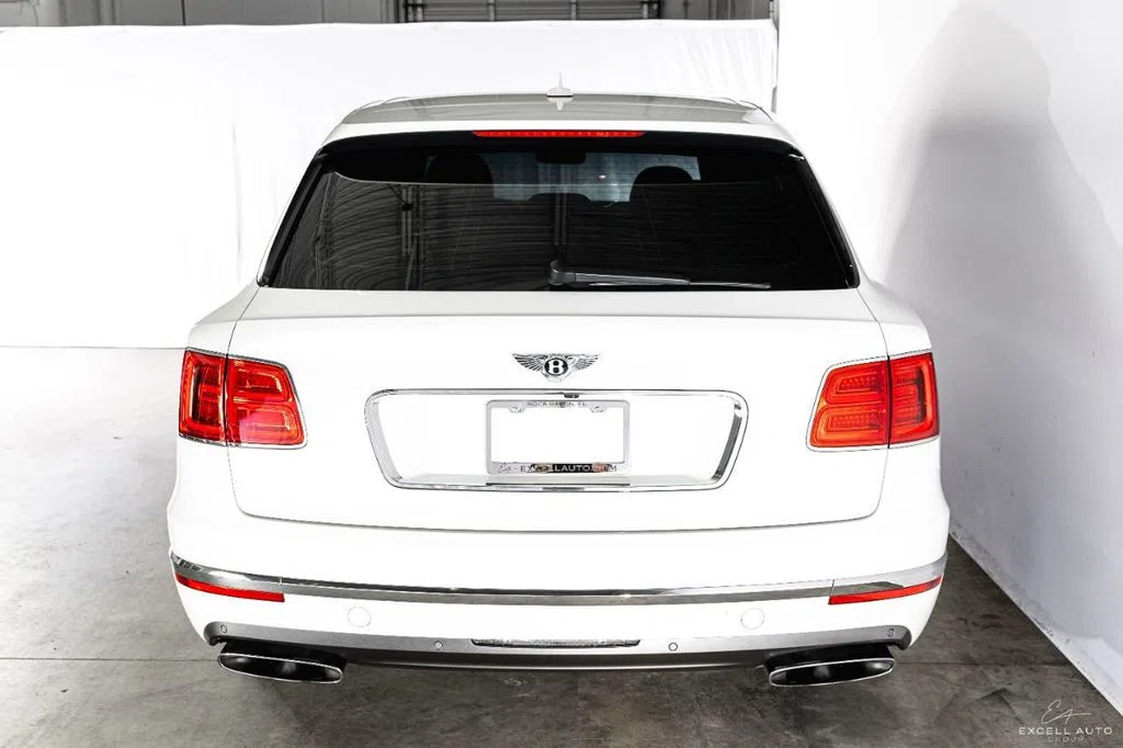 2018 Bentley Bentayga, rear three-quarter view, White