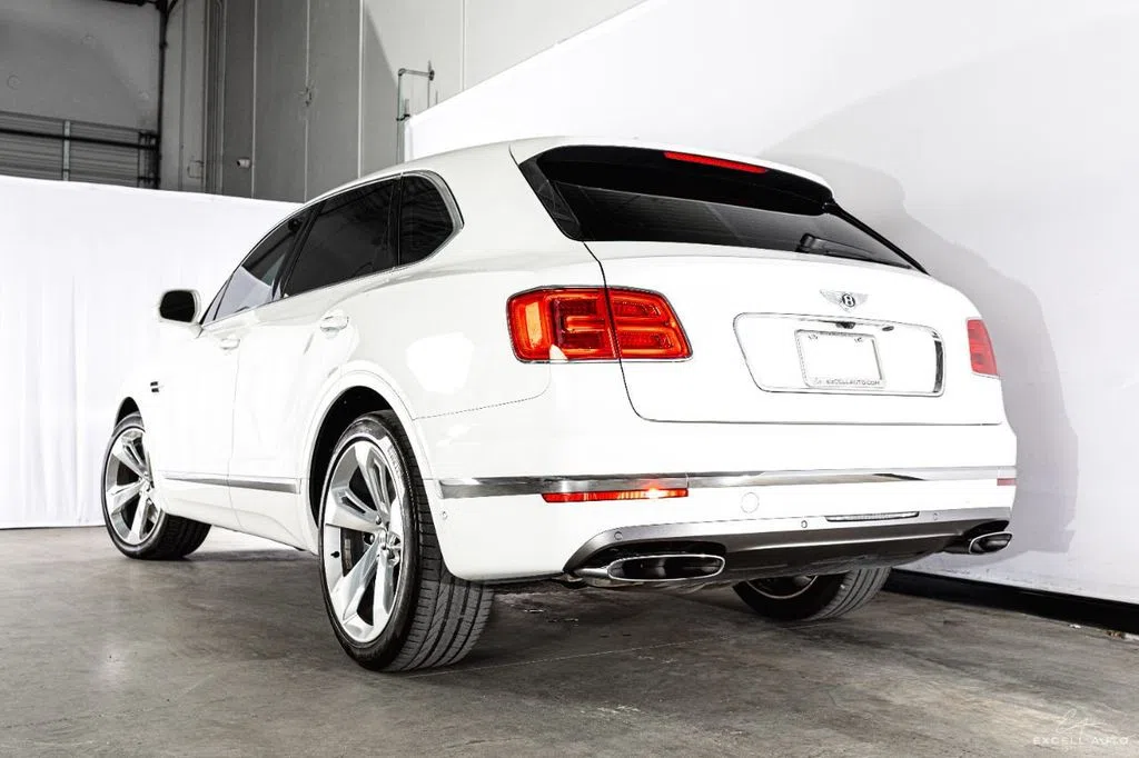 2018 Bentley Bentayga, rear three-quarter view, White