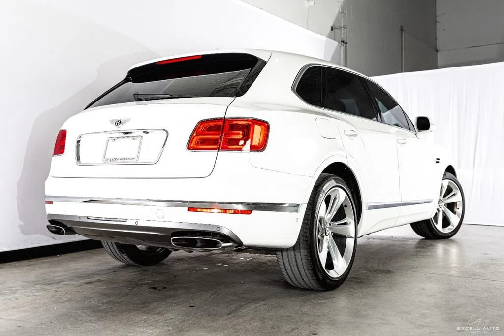 2018 Bentley Bentayga, rear three-quarter view, White