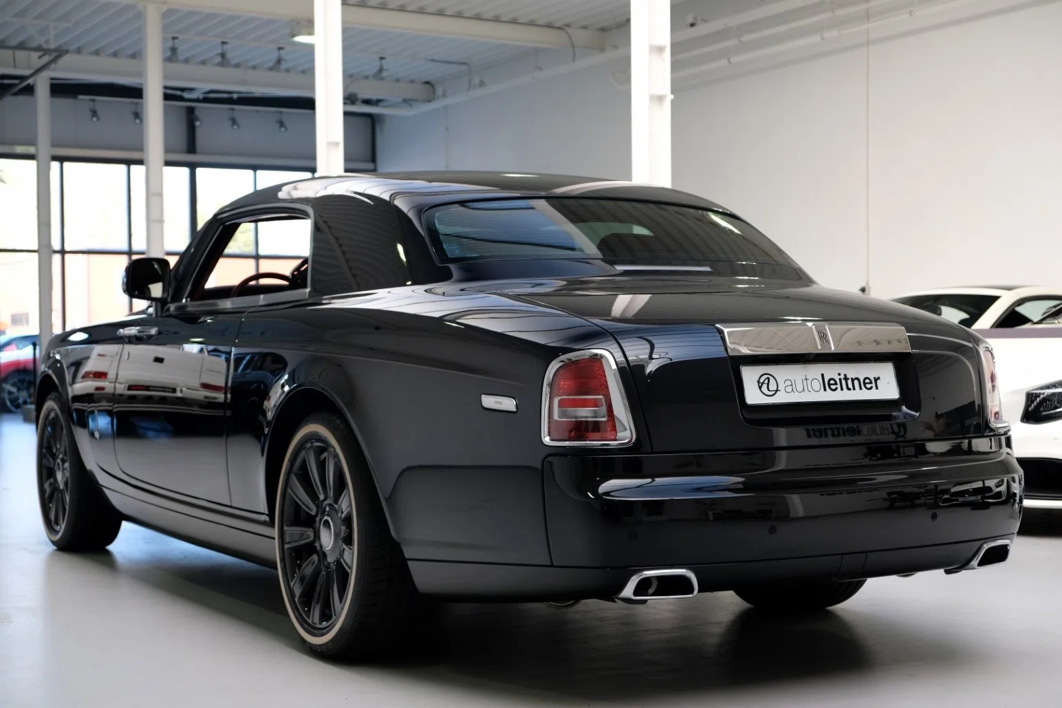 2017 Rolls Royce Phantom Coupe Zenith, rear three-quarter view, Crystal over Black solid metallic