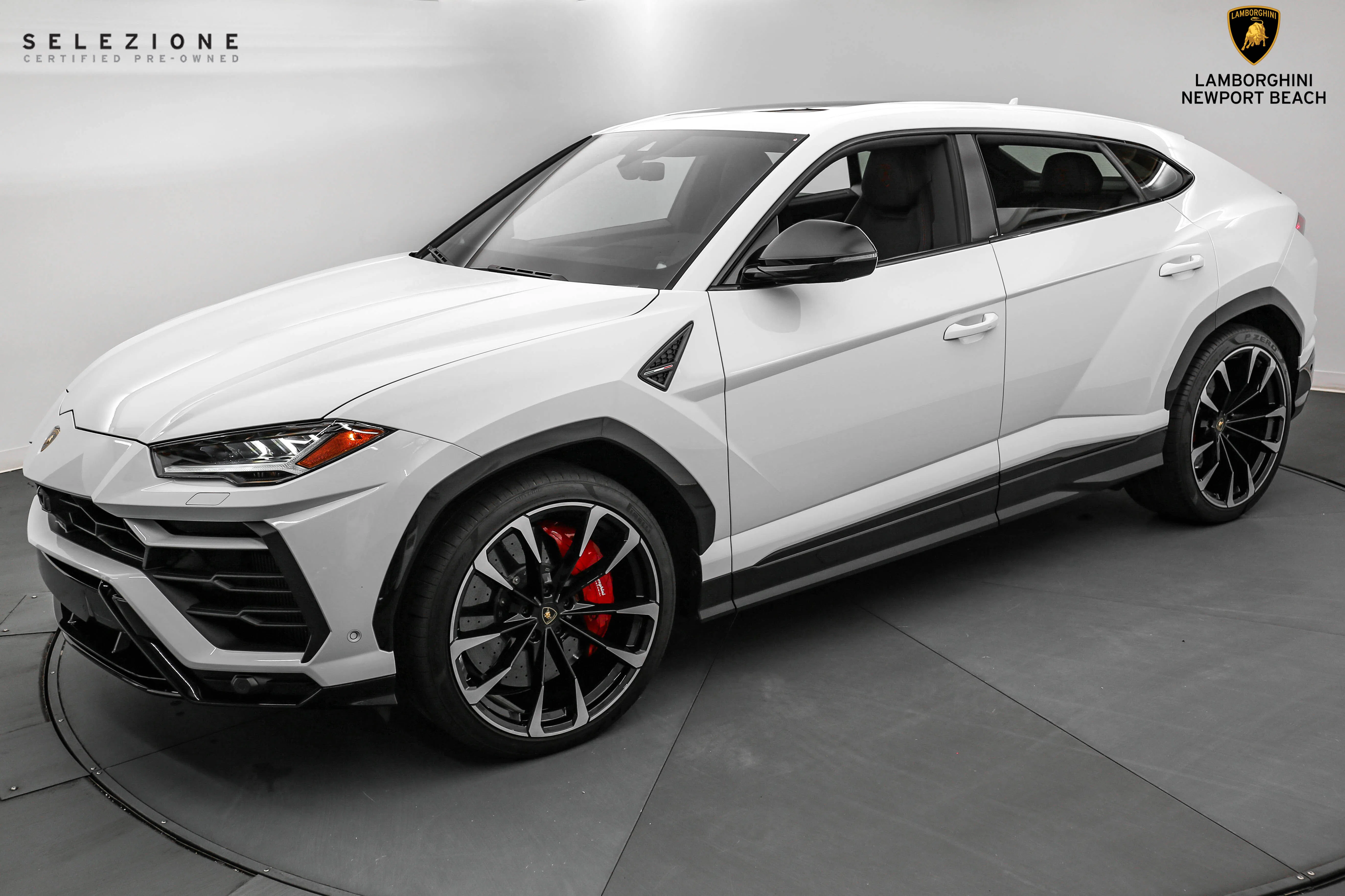 2021 Lamborghini Urus for sale, front three-quarter view, Bianco Icarus Metallic