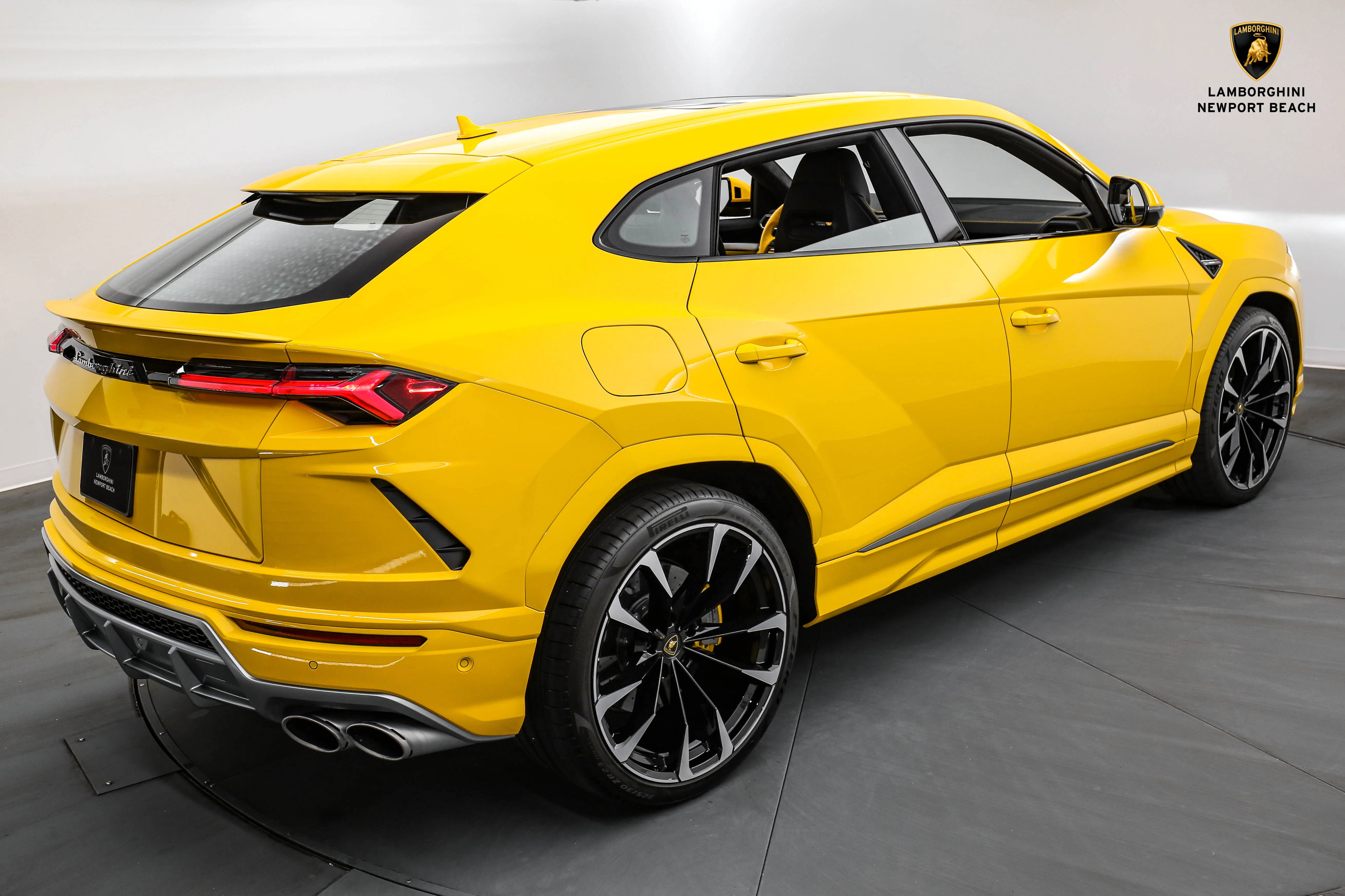 2022 Lamborghini Urus, rear three-quarter view, Giallo Auge