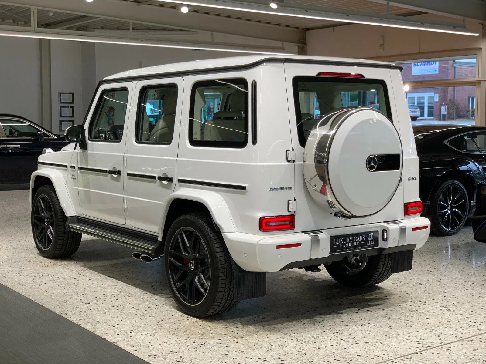 2019 Mercedes-Benz G 63 AMG, rear three-quarter view, Polar White