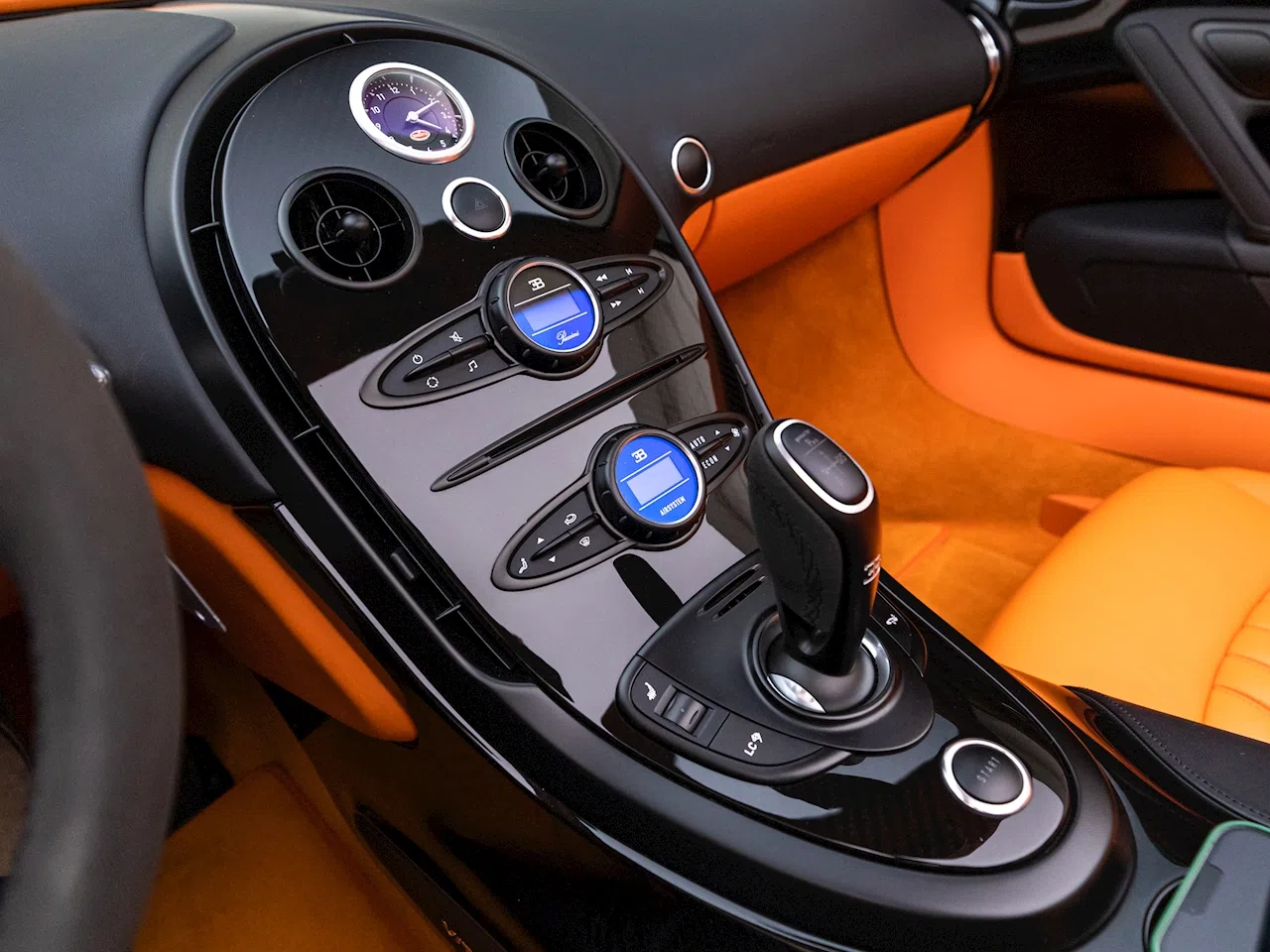 2015 Bugatti Veyron Grand Sport Vitesse interior, center console, Orange & Black Leather