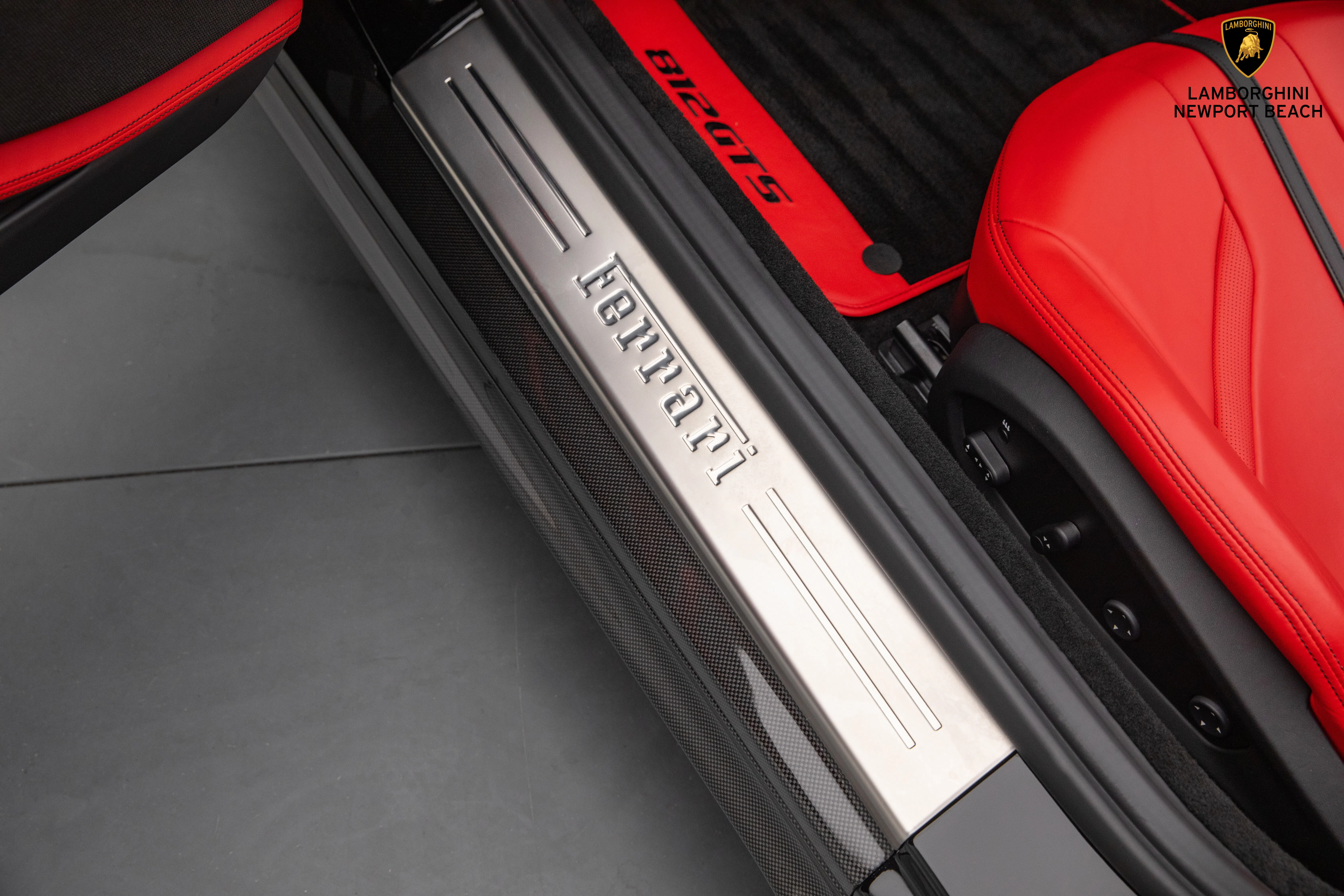 2021 Ferrari 812 GTS interior, door sill, Rosso Ferrari