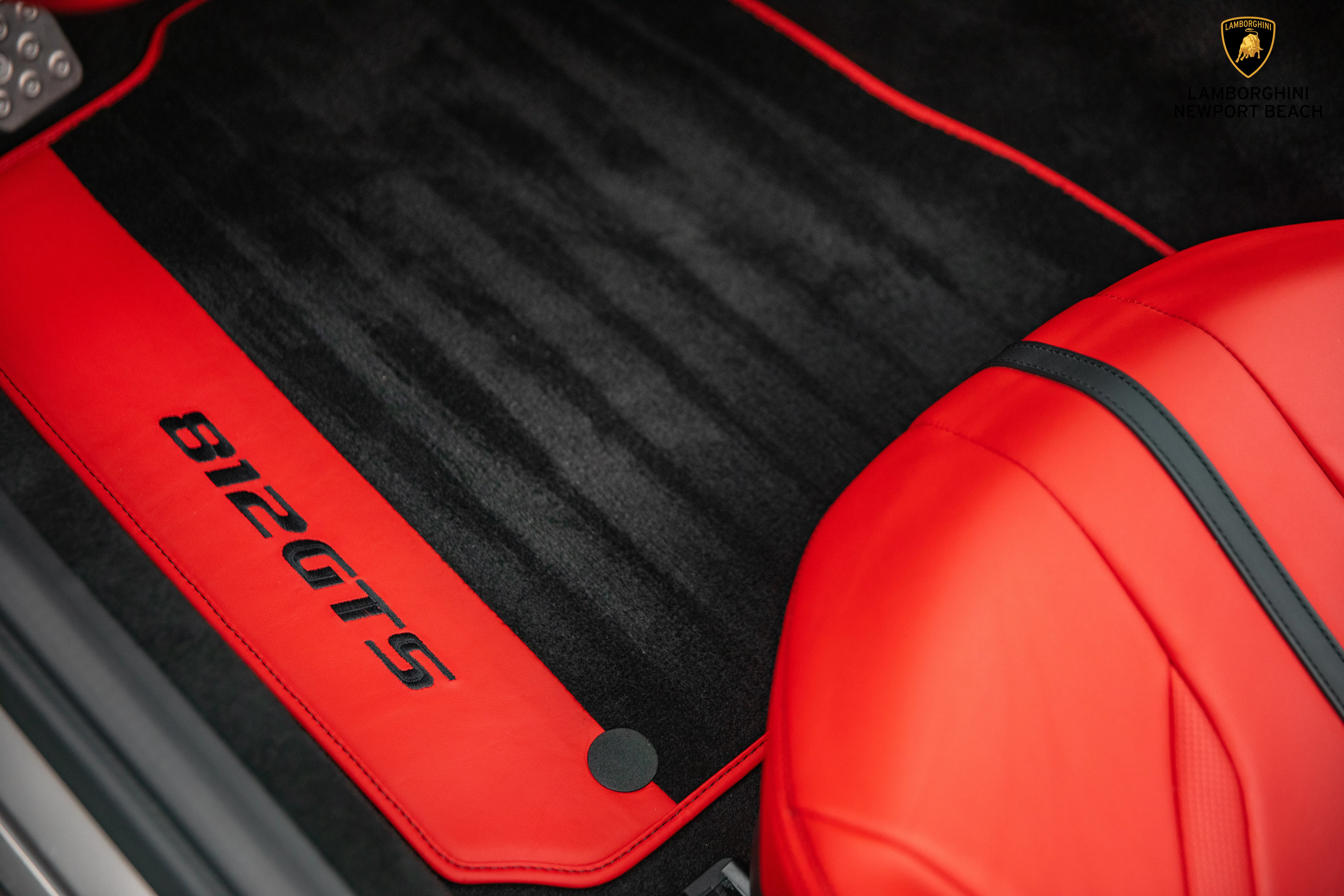 2021 Ferrari 812 GTS interior, door sill, Rosso Ferrari