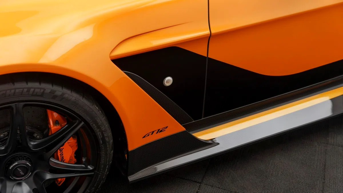 2016 Aston Martin Vantage GT12, side profile, Orange