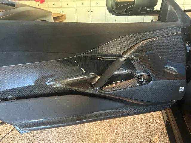 2022 Ferrari 812 Competizione interior, door panel, Black Alcantara w/ Yellow