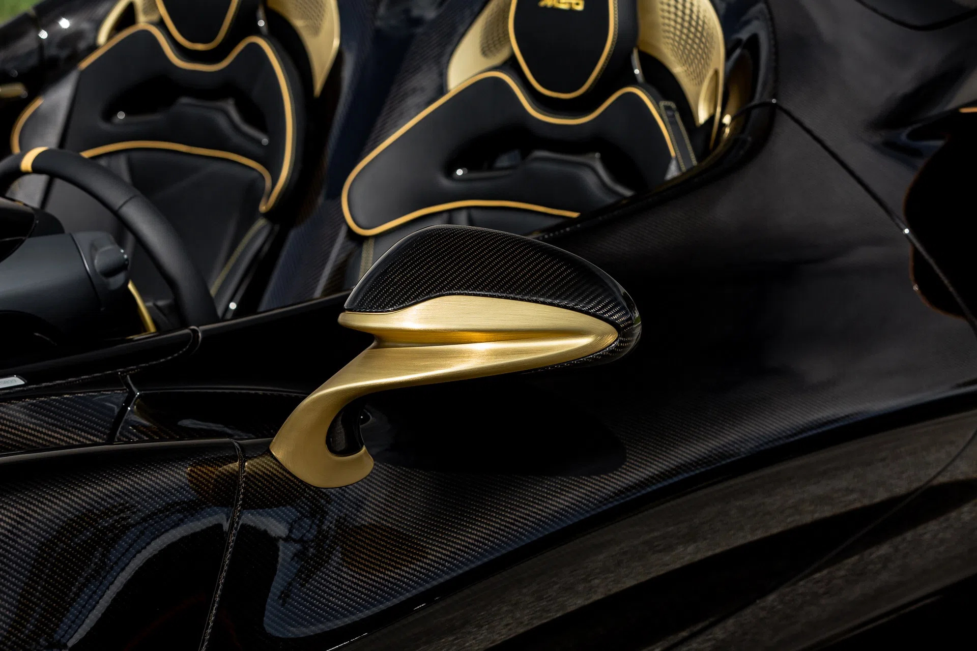 2021 McLaren Elva interior, Gold Tinted Exposed Carbon Fiber