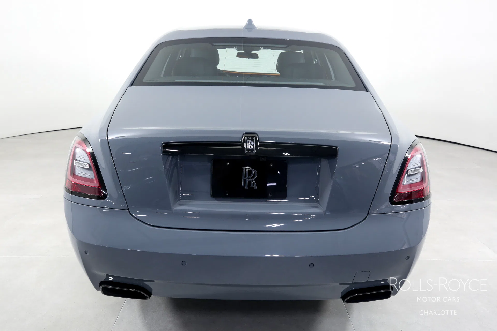 2022 Rolls-Royce Black Badge Ghost, rear three-quarter view, Special Order Burnout Grey