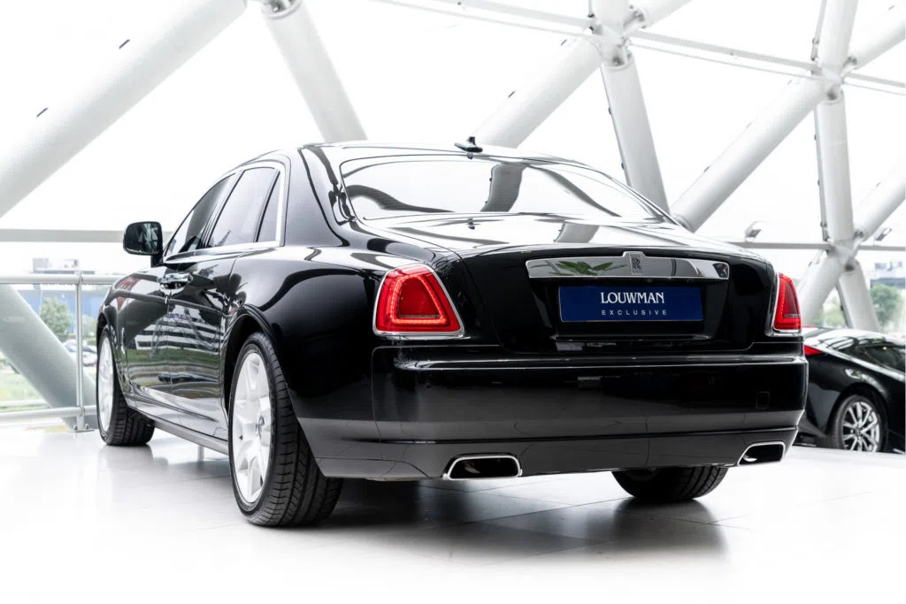2010 Rolls-Royce Ghost, rear three-quarter view, Black